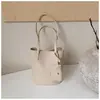 Bolsa de Mano Tejida Shuai Mijia para Mujer 2026 Nuevo Bolso Cubo de Verano Alta Apariencia Temperamento de Nicho Bolso de Hombro Simple