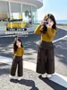 Pantalones de pierna ancha para niña Otoño 2026 Moda Nueva para Bebé Niña Dos en Uno Pantalones Casuales Pantalones a Cuadros para Niños Estilo Despeinado Hacia Atrás Modernos