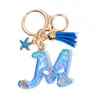 Llavero Colgante Temático Océano Azul con Borla de Estrella de Mar, Llavero de Resina Encanto para Bolso con 26 Letras
