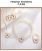 Conjunto de joyería para dama con diseño de mariposa y perlas transfronterizas, pulsera, pendientes, collar y anillo, disponible al por mayor.