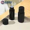 En stock transfronterizo 10-200 ml Botella de vidrio de amatista negra europea para aceite esencial hombro plano botella con tapón interior botella secundaria para cosméticos