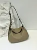 2026 Nova Bolsa Feminina de Couro Genuíno Crescente Senso de Design Nicho Bolsa Transversal Leve Luxo Sensação de Alto Padrão Bolsa de Mão Bolsa de Ombro