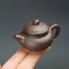 Mini Tetera de Arcilla Púrpura Se Puede Levantar y Jugar con la Punta del Dedo Mascota de Té para Jugar Té Accesorios de Juego de Té Kung Fu Adornos Suministro Directo de Fábrica