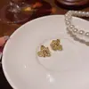 Pendientes Pequeños Frescos Elegantes Metálicos de Flor para Mujer Luz de Lujo Mismo Estilo Famoso en Internet Pendientes de Piedra Ojo de Gato Pendientes