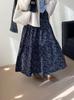 Al final de la falda de florales con forro de polar retro azul coreano para mujer, falda de invierno cálida de cintura alta con caída tipo paraguas 2320