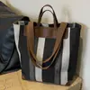 Bolsa de Lona Bolsa Tote Feminina Grande Capacidade Outono e Inverno 2026 Novo Estilo Versátil Cor Contrastante Textura Ombro Único Bolsa para Aula e Trabalho