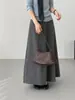 Esa Falda de Aire Plisada es una Elegante Falda Media Gris Estilo Coreano para Mujer, con un Estilo Relajado, Efecto Adelgazante y Falda de Paraguas Elástica en Línea A 8252
