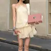 Vestido beige de encaje sin mangas con cuello halter, espalda descubierta, suelto para mujer, nuevo vestido corto de línea A para otoño 2026 con tiras de amarre