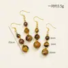 Novos Brincos de Cristal Natural Joias Femininas Atacado Pingente Pedra Olho de Tigre Cristal Luz Luxo Alto Padrão Outono e Inverno Transfronteiriço