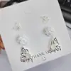 Pendientes de botón Retro Franceses de Rosa y Mariposa para Mujer Simples Elegantes de Gama Alta Dulces de Diseño de Nicho Modernos