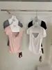 WGWE9308 Guangzhou Treze Hong Roupas Femininas Verão 2026 Novo Top Camiseta Manga Curta Decote U Ombro Normal Cintura Marcada com Babados