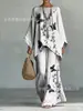 Nuevo conjunto de dos piezas para mujer: camiseta casual de moda con estampado transfronterizo, cuello redondo, manga larga + pantalones de campana