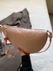 Bolsa de Dumpling Tejida Personalizada Estilo Callejero 2026, Bolso tipo Silla de Montar de Nicho, Bolso Pequeño Cruzado para Mujer, Bolso Croissant Estilo Perezoso, Bolso para Viajar
