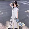 2026 Nuevo Estilo de Verano Dulce Camisa Polo de Manga Corta Hello Kitty con Pantalones de Pierna Ancha de Encaje, Conjunto Casual y Cómodo de Dos Piezas