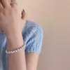 Pulseira Manta Pérola Rosa Feminina com Contas de Alto Padrão Nicho Novo Estilo Chinês Bola de Cristal Diamante Joia de Mão para Ano Novo Atacado