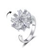 Anillo giratorio de circonio con forma de copo de nieve superbrillante para mujer, transfronterizo europeo y americano, de alta gama, ligero y de lujo, giratorio y moderno.
