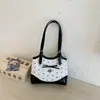 La popular bolsa de gran capacidad para mujer de este año, nueva y elegante bolsa de hombro informal de primavera 2026, bolsa tote texturizada para el trabajo