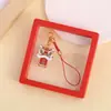 Colgante para teléfono móvil de danza del león de bendición, accesorio para bolso y llavero de coche, colgante auspicioso de hilo rojo estilo chino, disponible para venta al por mayor