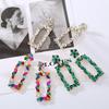 Primavera nuevos aretes cuadrados de flor de diamantes de aleación de moda exagerada europea y americana personalidad temperamento aretes netos rojos al por mayor