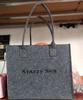 2027 Año de la Oveja Nueva Bolsa de Fieltro Logo Personalizable Bolsa de Tote de Regalo Regalo de Año Nuevo Bolsa de Compras de Fieltro