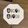 Un par de puntas de uñas [Puntos Polka Oro Negro] retro y elegantes, de color negro-marrón, adornadas con oro, estilo ojo de gato estrellado, finamente brillantes, hechas a mano