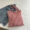 Bolso de lona a rayas simple de gran capacidad para mujer, estilo artístico perezoso, bolso de compras de otoño e invierno, bolso de un solo hombro, bolso grande