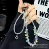 Corrente para Celular Feminina de Alta Qualidade com Contas em Gota Dupla Corrente para Pendurar Celular Pingente Exquisito de Zircônia Cristal de Pujiang Cordão Atacado