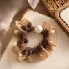 Elástico de cabelo de rede com pérolas Dongdaemun coreano 2026 novo modelo, elástico de cabelo versátil de alta costura para coque