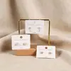 3.5*5cm blanco cartón para aretes gancho tarjeta para aretes puede colgar aretes embalaje tarjeta repujada tarjeta plata 925 tarjeta gruesa