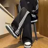 Pantalones deportivos atléticos holgados de pierna recta para hombre para primavera y verano con tres rayas en los lados, pantalones largos casuales de moda estilo americano para estudiantes