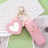Llavero con caja creativa de cuero PU para guardar labiales, con espejo de maquillaje en forma de corazón y colgante de cubierta protectora para labiales, para Amazon transfronterizo