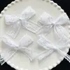 Lazo de encaje blanco puro japonés DIY tocado pasador accesorios para ropa y calzado al por mayor moño de mano al por mayor
