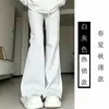 Calça Flare Estilo Americano para Mulheres Nova Coleção Primavera e Outono 2026 Cintura Alta Cordão Ajustável Corte Justo Caimento Fluido Emagrecedor Versátil Esportivo Casual