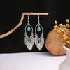 Pendientes Retro Étnicos Europeos y Americanos de Turquesa Azul con Diseño de Anillo Hueco, Colgantes de Borla Floral de Gama Alta, Pendientes Exagerados de Gota de Agua