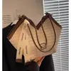 Bolso de paja transfronterizo de gran capacidad para mujer, nuevo bolso de hombro versátil para la playa 2026, bolso tote para vacaciones en la playa y uso diario