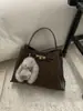 Bolso Pequeño Retro de Alta Gama Transfronterizo Otoño e Invierno para Mujer 2026 Nueva Moda Versátil Bolso Cruzado Bolso de Mano Bolso Cubo
