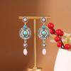 Aretes Europeos y Americanos Bohemios con Borlas Turquesas Retro Imitación Plata Miao Estilo Minoritario Aleación Huecos Venta al por Mayor