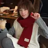 Bufanda de punto lisa y versátil 100% lana para mujer, perfecta para otoño e invierno, proporcionando calidez y un ambiente acogedor; venta al por mayor de calentadores de cuello y bufandas gruesos