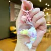 Nuevo llavero de muñeca de delfín con arena movediza relleno de aceite, colgante para mochila, decoración para bolso de pareja, regalo pequeño para venta al por mayor