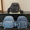 Bolso de mezclilla para mujer, nueva moda primavera 2026, nicho elegante, bolso de hombro cruzado, bolso de teléfono móvil de alta estética moderno