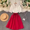 Vestido de Primavera Feminino Redutor de Idade Manga Curta Senso de Design Nicho Costura em Cor Contrastante Afina a Cintura Saia Evasê Guarda-chuva