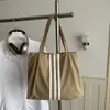 Bolso tote de lona de gran capacidad estilo casual coreano 2026 para mujer, nuevo bolso de mano de moda para estudiantes, adecuado para la escuela y el trabajo