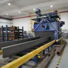 Máquina de jateamento por granalha com transportador de roletes Q69, direto do fabricante, especializada na remoção de ferrugem em chapas de aço/vigas H/vigas I