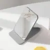 Espejo pequeño de cuero PU, espejo de maquillaje plegable, mini espejo portátil de escritorio, espejo de maquillaje imprimible, espejo de belleza al por mayor