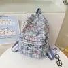 Nova Mochila Xadrez Estilo Graffiti de Nicho 2026 para Alunos do Ensino Fundamental e Médio, Mochila de Lona de Grande Capacidade para Meninas