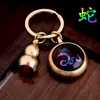 Llavero giratorio de latón y vidrio luminoso con zodiaco y calabaza de cobre para los doce signos del zodiaco, llavero zodiacal para coche