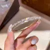 Pulsera Ovalada de Zirconia Chapada en Oro Real de 18k Moda Simple Versátil Anillo de Mano Lujo Ligero Nicho Sensación de Alta Gama Joyería de Mano