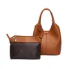 Bolso de hombro para viajes transfronterizos de gran capacidad, bolso tipo cubo con patrón de lichi, bolso para madre e hijo, bolso cruzado moderno y versátil, bolso de mujer hecho a medida