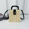 Bolsa de palha trançada transfronteiriça com contas para mulher, bolsa quadrada retrô, bolsa de praia para a beira-mar, bolsa de mão para ombro