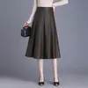 Elegante y a la moda falda midi de piel sintética para mujer, nueva colección otoño 2026, de cintura alta, falda de línea A que estiliza, versátil y de corte holgado con dobladillo ancho